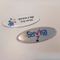 name-tag-ellipse-70X24-with-plastic-coverage.jpg